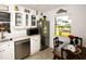 Well-lit kitchen with stainless steel appliances, ample counter space, and a breakfast nook with natural light at 6504 Heritage Ln # 99, Bradenton, FL 34209