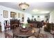 Spacious living area with classic furniture, a decorative rug, and ample natural light at 6504 Heritage Ln # 99, Bradenton, FL 34209