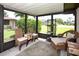 Relaxing outdoor patio with comfortable seating, a view of the well-manicured lawn, and lush landscaping at 6504 Heritage Ln # 99, Bradenton, FL 34209