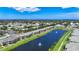 Beautiful aerial view of a lakeside community with a large pond and water fountains at 6604 7Th Avenue W Cir, Bradenton, FL 34209