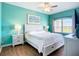 The beautifully appointed bedroom features a ceiling fan and a big window at 6604 7Th Avenue W Cir, Bradenton, FL 34209