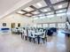 Spacious clubhouse interior featuring tables, chairs, and comfortable lounge seating at 6604 7Th Avenue W Cir, Bradenton, FL 34209