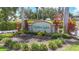 Manicured landscape featuring the Hidden Lake community sign with palm trees at 6604 7Th Avenue W Cir, Bradenton, FL 34209
