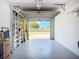 Clean garage with open door and various storage solutions at 6604 7Th Avenue W Cir, Bradenton, FL 34209