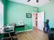 A home office featuring light laminate floors and a comfortable layout at 6604 7Th Avenue W Cir, Bradenton, FL 34209