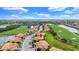 Aerial view of community showing the golf course and beautiful landscaping at 6918 Grand Estuary Trl # 104, Bradenton, FL 34212