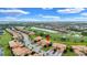 Beautiful aerial view of community homes overlooking the lush golf course and scenic water features at 6918 Grand Estuary Trl # 104, Bradenton, FL 34212
