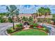 Beautiful entry to the community clubhouse with tropical landscaping at 6918 Grand Estuary Trl # 104, Bradenton, FL 34212