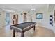 Spacious game room with a pool table, bar area, and ample room for entertaining at 6918 Grand Estuary Trl # 104, Bradenton, FL 34212