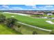 Scenic view of the lush golf course and community pond at 6918 Grand Estuary Trl # 104, Bradenton, FL 34212