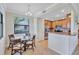 Cozy kitchen and breakfast nook with stainless steel appliances and granite countertops at 6918 Grand Estuary Trl # 104, Bradenton, FL 34212