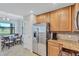 Bright kitchen with stainless steel appliances, granite countertops, and a breakfast nook with natural light at 6918 Grand Estuary Trl # 104, Bradenton, FL 34212