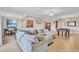 Open-concept living space featuring a modern kitchen, comfortable seating, and elegant decor at 6918 Grand Estuary Trl # 104, Bradenton, FL 34212