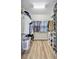 Spacious walk-in closet with custom shelving and ample storage space for clothes and accessories at 6918 Grand Estuary Trl # 104, Bradenton, FL 34212