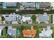 Aerial view of houses with boat docks along a canal, some with pools and manicured gardens in a desirable area at 726 Jungle Queen Way, Longboat Key, FL 34228