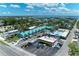 Aerial view of local business area with colorful buildings and a variety of commercial establishments at 726 Jungle Queen Way, Longboat Key, FL 34228