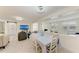 Bright dining and living areas featuring an open layout, modern finishes, and comfortable seating at 726 Jungle Queen Way, Longboat Key, FL 34228