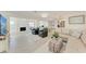 Bright and airy living room with a modern fireplace and open layout perfect for entertaining and relaxation at 726 Jungle Queen Way, Longboat Key, FL 34228
