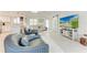 Cozy living area with modern decor, a large TV, and comfortable seating at 726 Jungle Queen Way, Longboat Key, FL 34228