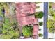 Aerial view of the community showcasing the red tile roofs, lush landscaping, and winding streets at 7674 Fairway Woods Dr # 1605, Sarasota, FL 34238