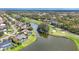 Aerial view of a golf course community showcasing beautiful homes and waterfront views at 7674 Fairway Woods Dr # 1605, Sarasota, FL 34238