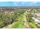 Aerial view of a golf course community showcasing lush greenery and well-maintained fairways at 7674 Fairway Woods Dr # 1605, Sarasota, FL 34238