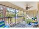 Relaxing balcony with a view of a pond and fountain at 7674 Fairway Woods Dr # 1605, Sarasota, FL 34238