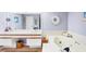 Bathroom features a soaking tub, double sinks, and tiled flooring at 7674 Fairway Woods Dr # 1605, Sarasota, FL 34238