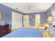 Bedroom with blue walls and an en suite bathroom at 7674 Fairway Woods Dr # 1605, Sarasota, FL 34238