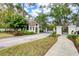 Inviting community entrance with a security gatehouse and lush landscaping at 7674 Fairway Woods Dr # 1605, Sarasota, FL 34238
