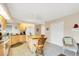 Well-lit kitchen with an island, tile floors, and ample cabinet space for storage and organization at 7674 Fairway Woods Dr # 1605, Sarasota, FL 34238