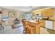 Cozy kitchen with a center island, ideal for casual dining and food preparation, and breakfast nook at 7674 Fairway Woods Dr # 1605, Sarasota, FL 34238