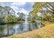 Community pond with a fountain feature creating an inviting outdoor ambiance at 7674 Fairway Woods Dr # 1605, Sarasota, FL 34238
