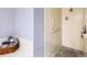 Shower with tiled walls, a pebble floor, and grab bars at 7674 Fairway Woods Dr # 1605, Sarasota, FL 34238