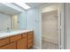 Well-lit bathroom featuring a vanity with wood cabinets and tub/shower combo at 814 Spring Lakes Blvd # 14, Bradenton, FL 34210