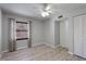 Comfortable bedroom features a ceiling fan, neutral decor, and closet for storage at 814 Spring Lakes Blvd # 14, Bradenton, FL 34210