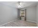 Neutral bedroom features a ceiling fan, neutral decor, and natural light from the window at 814 Spring Lakes Blvd # 14, Bradenton, FL 34210