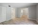 Open floor plan featuring a spacious bedroom with gray walls and wood-look flooring at 814 Spring Lakes Blvd # 14, Bradenton, FL 34210