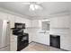 Bright kitchen featuring stainless steel appliances, white cabinets, and a modern sink at 814 Spring Lakes Blvd # 14, Bradenton, FL 34210