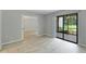 Open living room leads to a bright sunroom with sliding glass doors at 814 Spring Lakes Blvd # 14, Bradenton, FL 34210