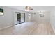 Spacious living room with sliding glass doors, modern decor, and an open layout at 814 Spring Lakes Blvd # 14, Bradenton, FL 34210