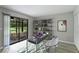 Bright office space with sliding glass doors to the lanai and a modern bookshelf at 814 Spring Lakes Blvd # 14, Bradenton, FL 34210