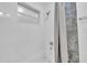 Clean bathroom featuring a white tub/shower with gray tile accents and a shower curtain at 946 Charlotte Ave, Sarasota, FL 34237