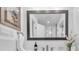 Modern bathroom featuring an elegant mirror, contemporary fixtures, and natural lighting at 946 Charlotte Ave, Sarasota, FL 34237