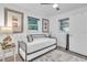 Light-filled bedroom with a daybed, modern décor, and plenty of natural light from large windows at 946 Charlotte Ave, Sarasota, FL 34237