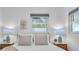 Bright bedroom showcasing a neatly made bed with decorative pillows, complemented by matching lamps at 946 Charlotte Ave, Sarasota, FL 34237
