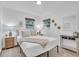 Well-lit bedroom with stylish decor, including a queen bed, matching lamps, and modern accents at 946 Charlotte Ave, Sarasota, FL 34237