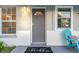 Charming front door and mat with two windows at 946 Charlotte Ave, Sarasota, FL 34237