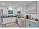 Updated kitchen with white cabinets, stainless steel appliances, and granite countertops at 946 Charlotte Ave, Sarasota, FL 34237