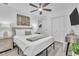 Relaxing main bedroom with a queen-sized bed, soft lighting, and calming decor at 946 Charlotte Ave, Sarasota, FL 34237